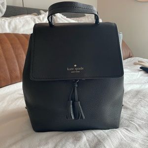 Leather Kate Spade backpack with warm pink interior